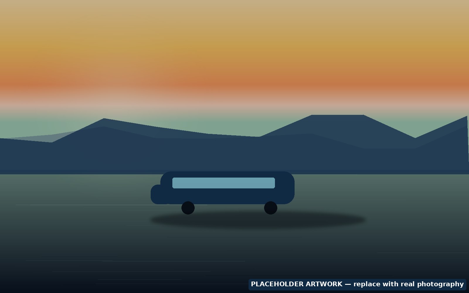 Campervan on an open road beside green fields